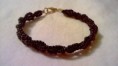 Bracciale intrecciato con perline      5 Euro