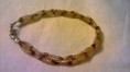 Bracciale intrecciato con perline        5 Euro