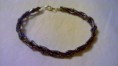 Bracciale intrecciato con perline     5 Euro